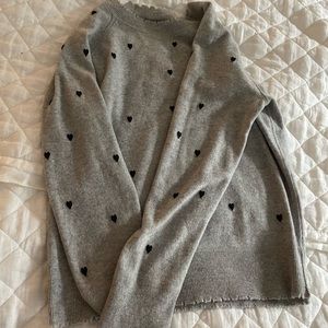 Women’s Aqua cashmere sweater with navy hearts and raw hem